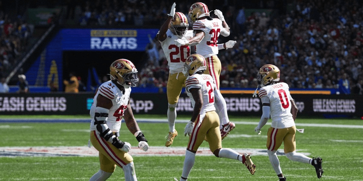 San Francisco 49ers players celebrating a play during a football game in London
