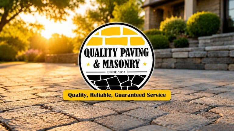 Quality Paving and Masonry logo over a stone driveway at sunset, showcasing professional paving and masonry services in New Jersey.