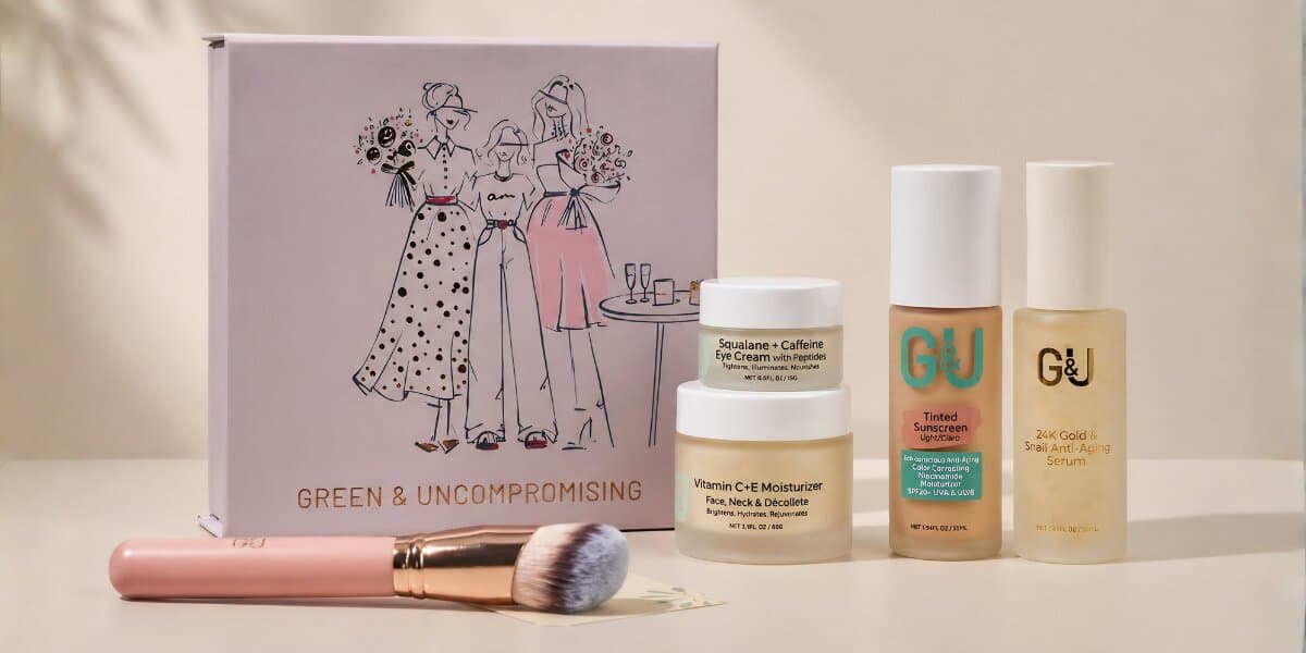 Skincare and beauty products arranged with a pink brush, featuring a box with stylish illustrations labeled "Green & Uncompromising." The tone is elegant and modern.