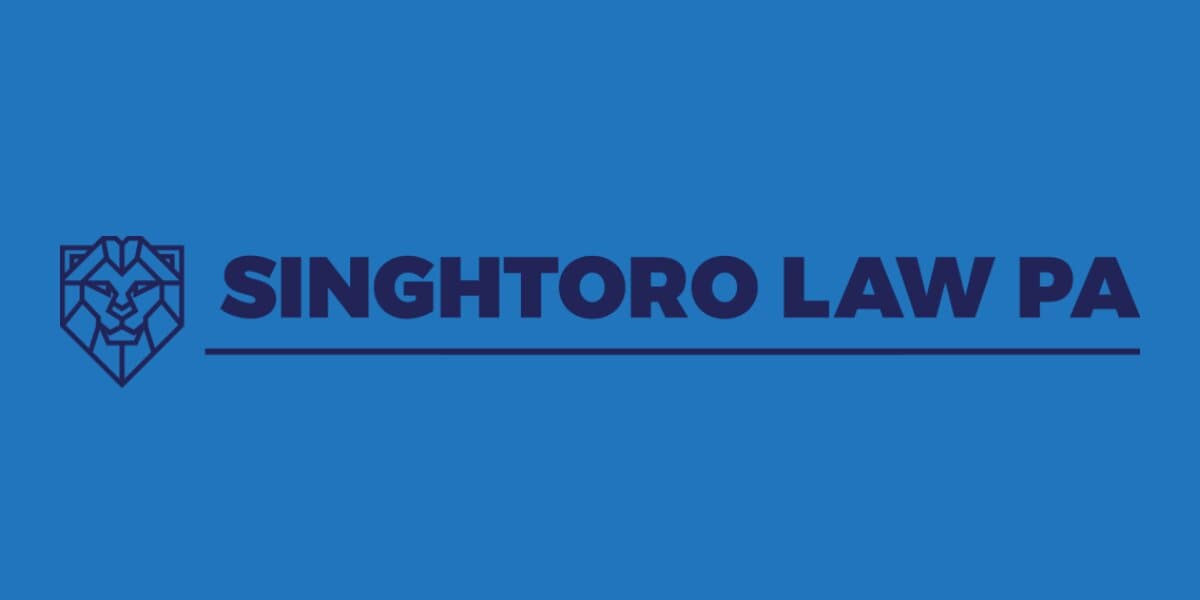 the Singh Toro Law PA logo, which includes a lion emblem and the firm's name in bold blue letters.