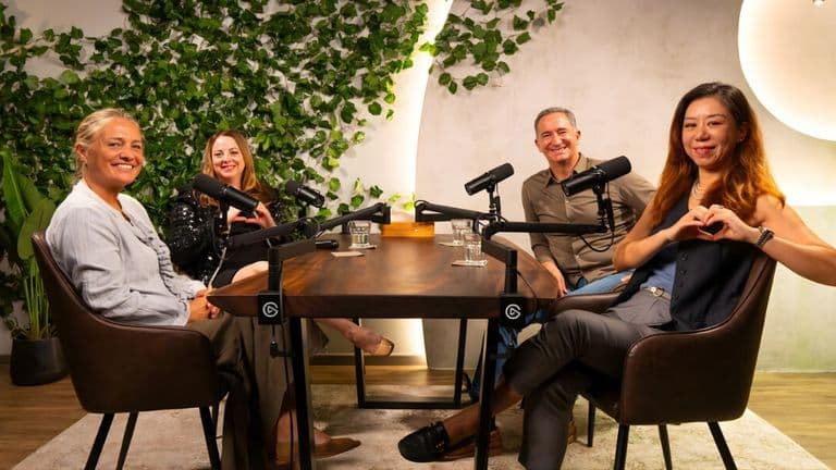 Podcast hosts and guests engage in a warm, empathetic conversation, recording Ella Podcasts about life's hardest moments.