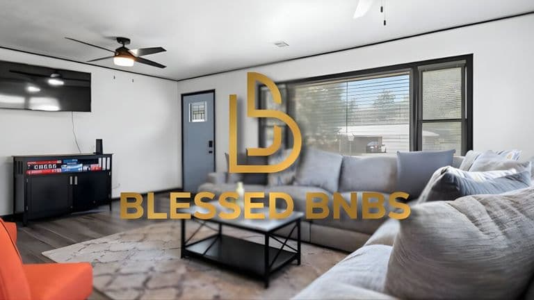Living room with luxury furniture, a TV, and a modern design, featuring the Blessed BNBS logo in the foreground