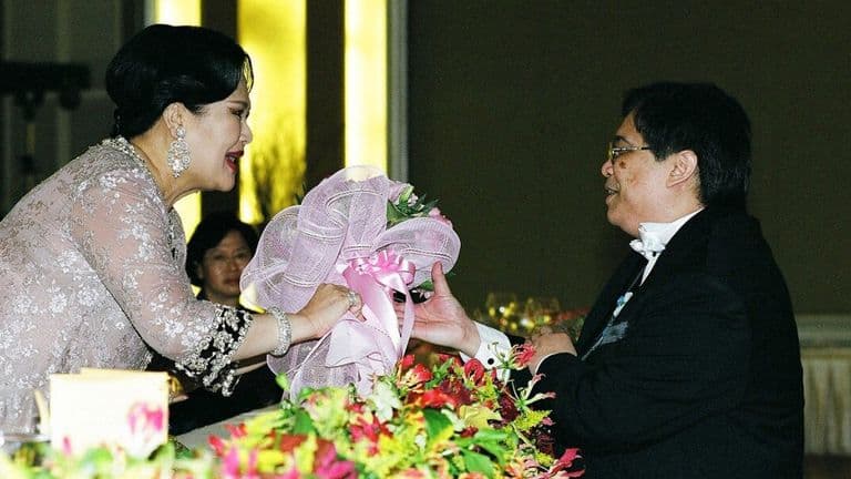 Bouquet presentation during a tribute performance honoring Queen Sirikit.