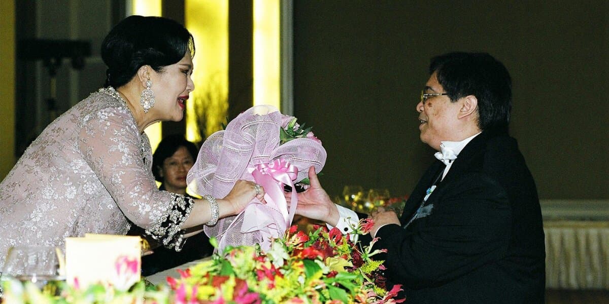 Bouquet presentation during a tribute performance honoring Queen Sirikit.