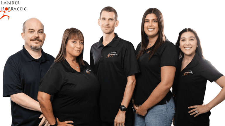 Lander Chiropractic team smiling together, representing personalized, family-focused chiropractic and acupuncture care in Brea for all ages.