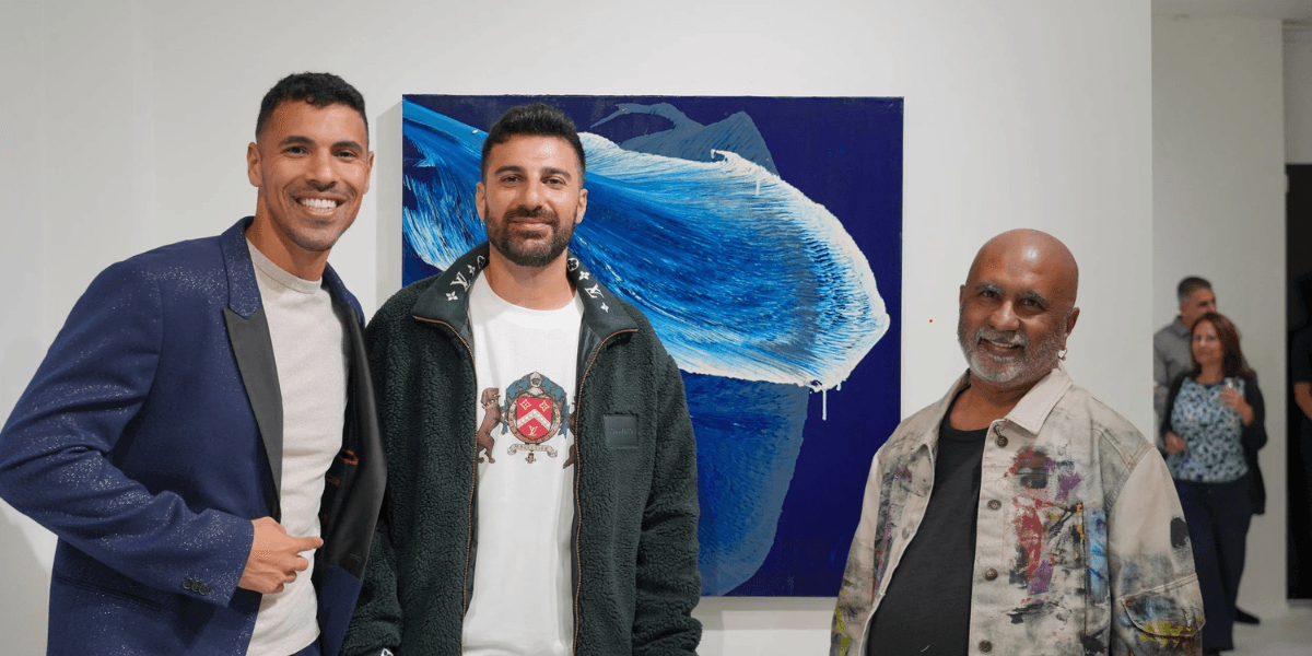 Artists Ritu Raj and colleagues at an exhibition in Phoenix, showcasing innovative abstract art and fostering creative community connections.