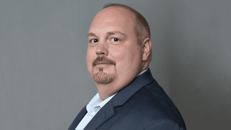 "Professional portrait of Scott, a leader in wealth management, offering tax planning and financial advisory services for affluent clients