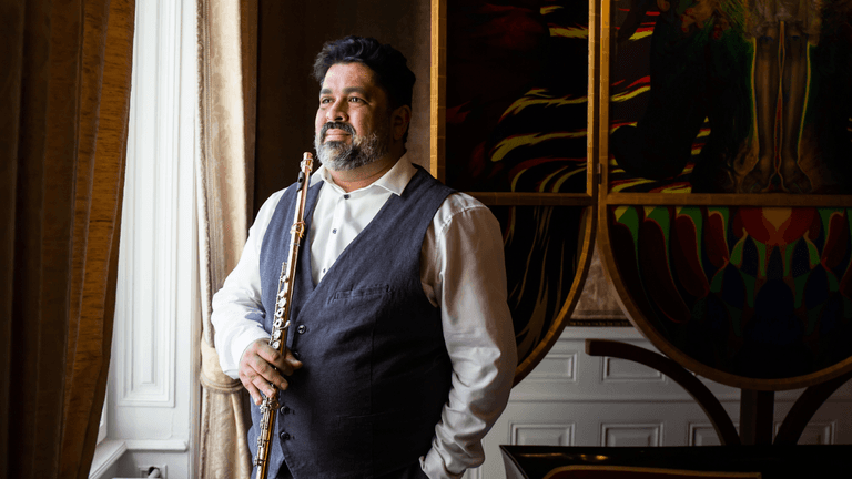 "James Strauss, world-renowned flutist, celebrating his 50th anniversary with a performance that showcases his golden tone and artistry."
