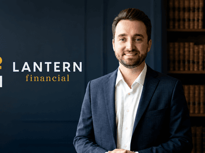 A professional man in a suit stands next to a financial services logo