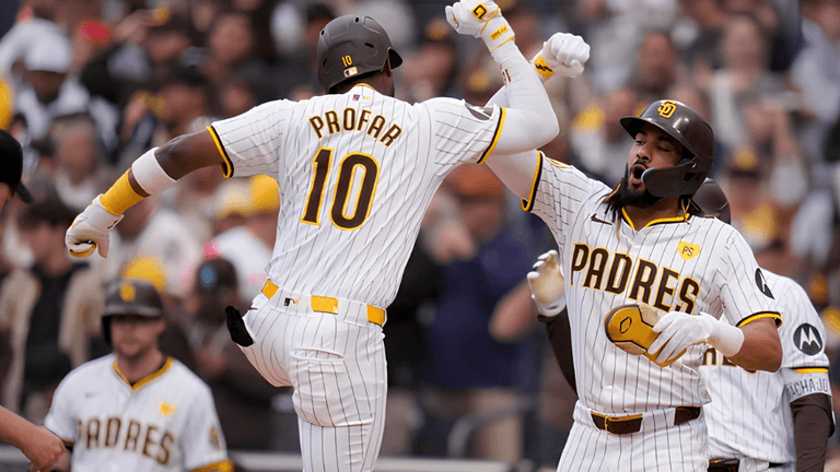 Two San Diego Padres players celebrate a home run during a game