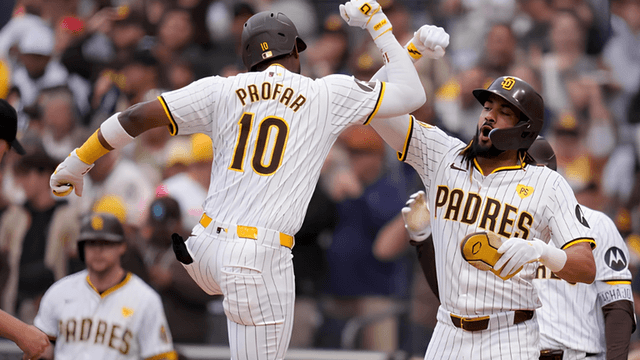 Two San Diego Padres players celebrate a home run during a game