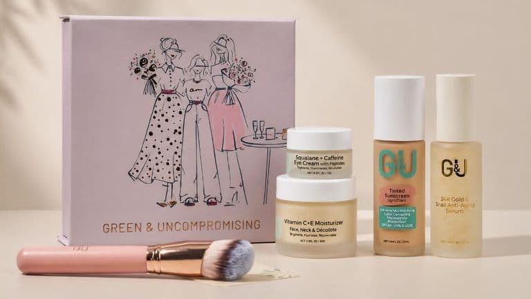 Skincare and beauty products arranged with a pink brush, featuring a box with stylish illustrations labeled "Green & Uncompromising." The tone is elegant and modern.
