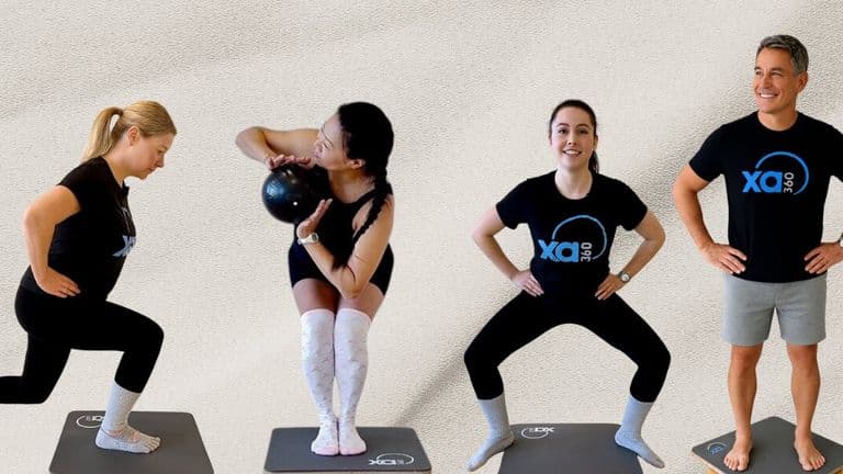 diverse group of individuals performing various exercises on mats, showcasing functional fitness and movement training.