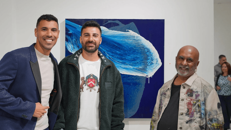 Artists Ritu Raj and colleagues at an exhibition in Phoenix, showcasing innovative abstract art and fostering creative community connections.