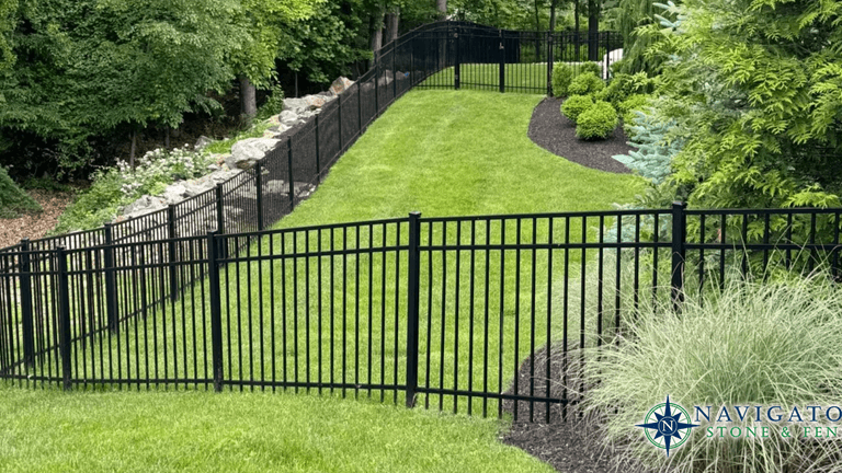 Hardscaping company designing custom stone patios, fences, and outdoor living spaces with craftsmanship, client-focused service, and durable landscape transformations.