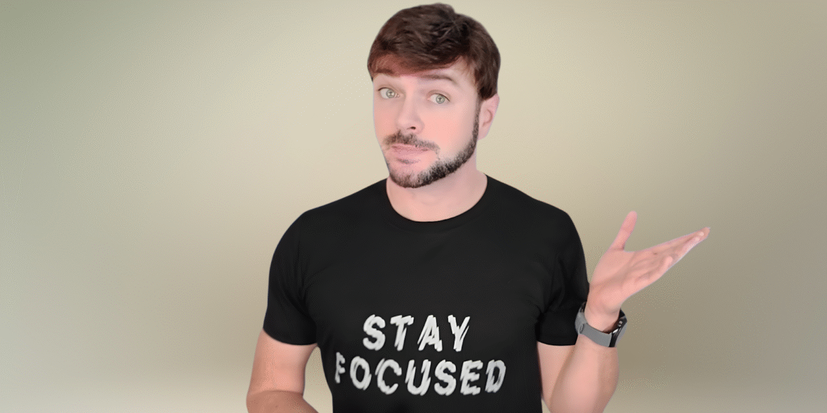 Chris Gibson, holistic esthetician, shares skincare tips in a 'Stay Focused' t-shirt, embodying a natural beauty philosophy.