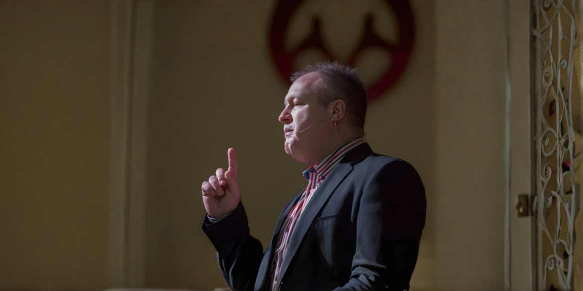 Nico Smit speaking passionately at an event, inspiring the crowd with his message of faith.