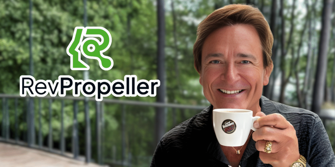 Smiling man at an outdoor café holding a white coffee mug, representing RevPropeller’s focus on financial peace for pastors.