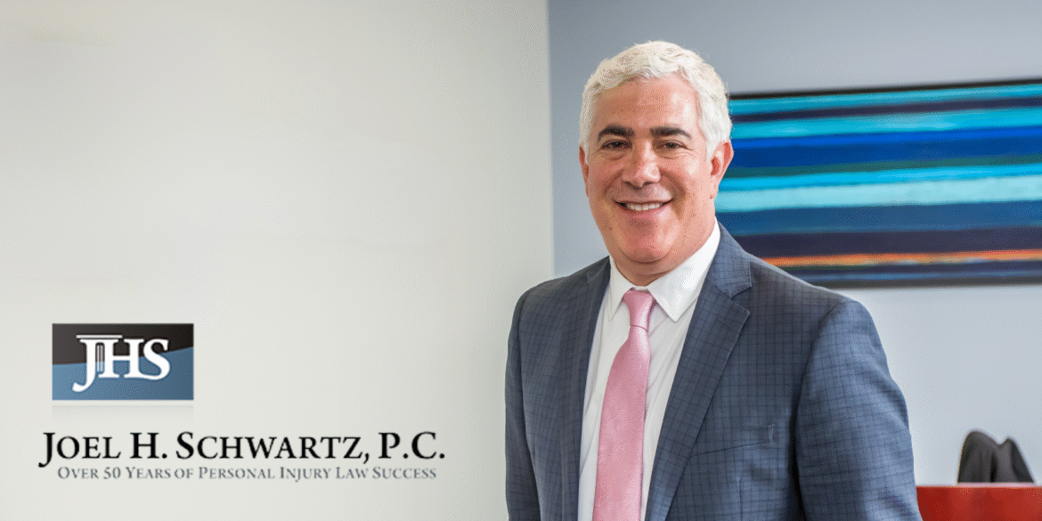 “Professional attorney in suit standing beside Joel H. Schwartz, P.C. branding, representing the firm’s personal injury expertise and client-focused legal services.”