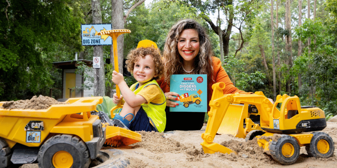 Ghina reading with children, pointing to a page from her educational book "Let’s Learn Numbers."