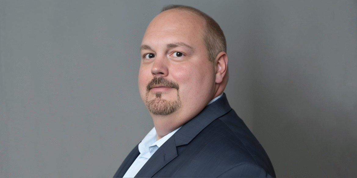 "Professional portrait of Scott, a leader in wealth management, offering tax planning and financial advisory services for affluent clients